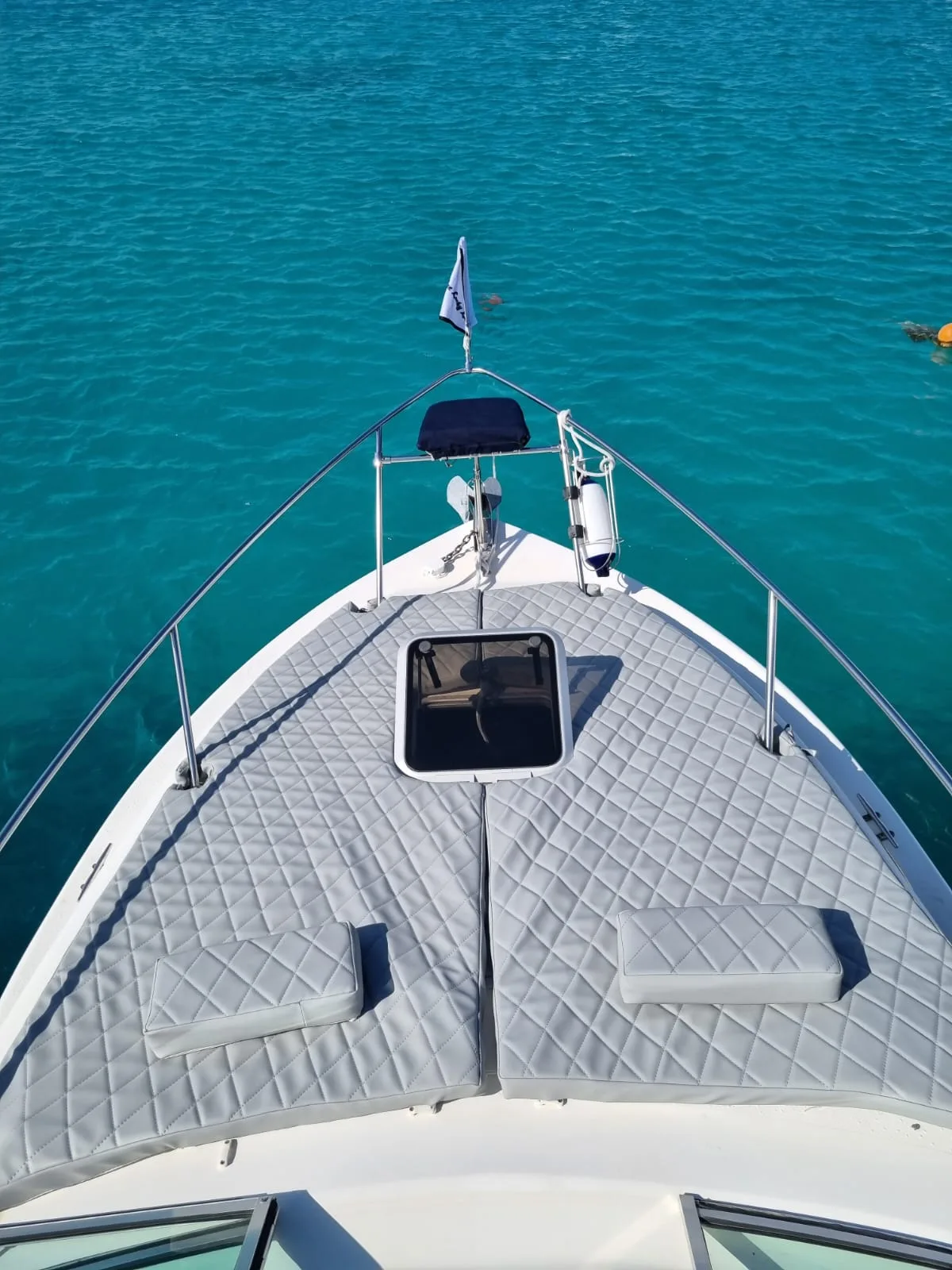 Looking forward over the bow of One Lucky Lady at open sea